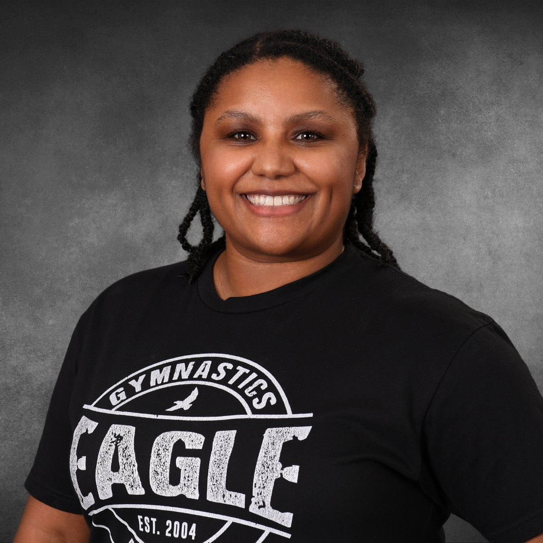 A woman wearing a black shirt that says eagle on it