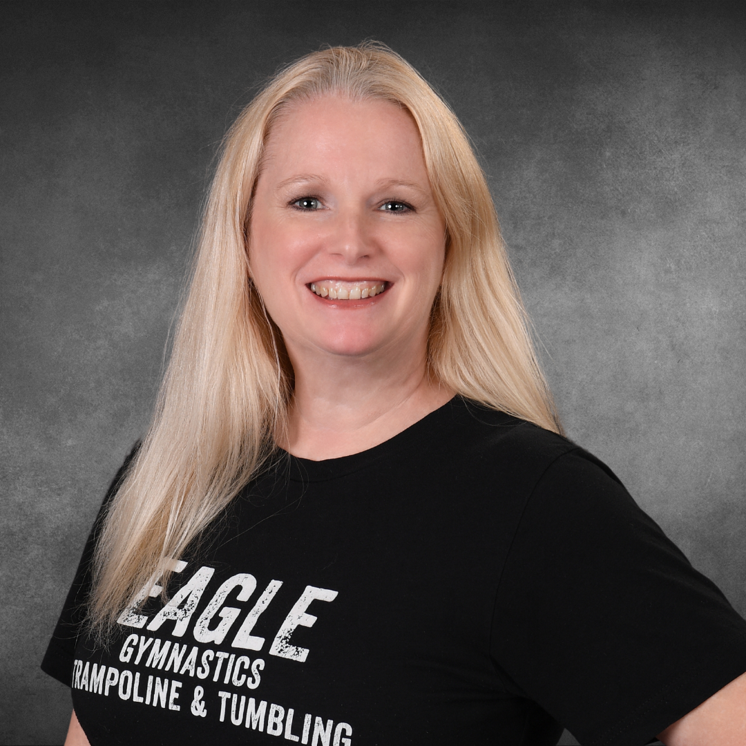 A woman wearing an eagle gymnastics trampoline and tumbling shirt