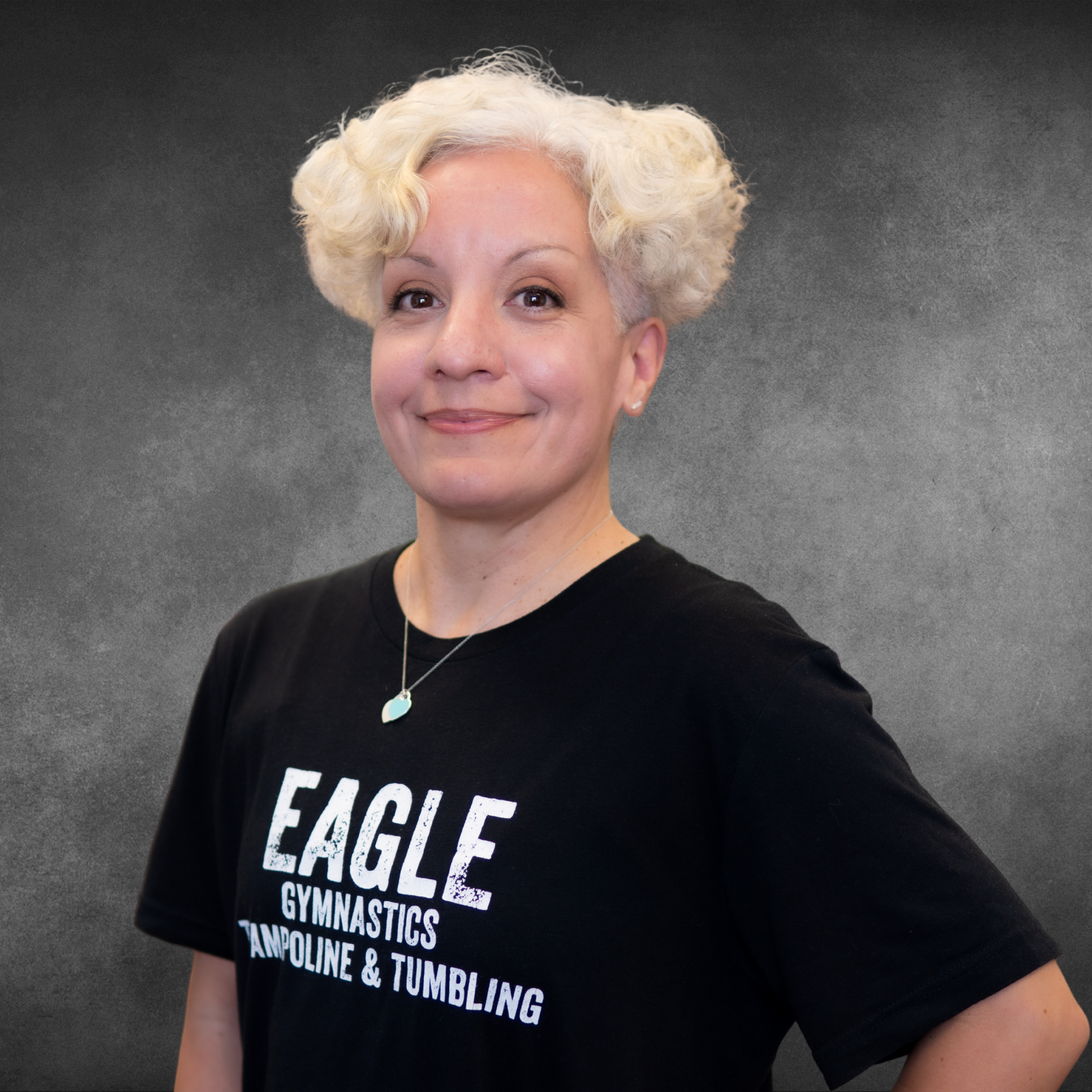 A woman wearing a black shirt that says eagle on it