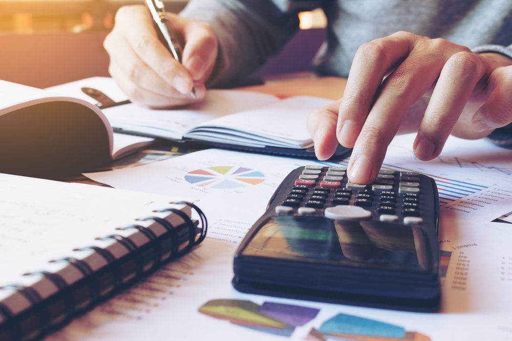 Man Doing Finances — Accountants Near Me in Hamlyn Terrace, NSW