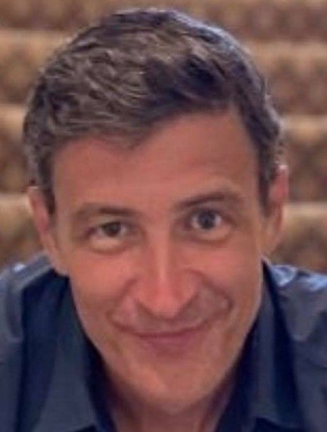 A close-up of a smiling man, radiating confidence—embark on your pallet recycling journey with The Simplest Biz Training