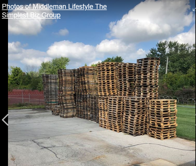 A bunch of wooden pallets are stacked on top of each other