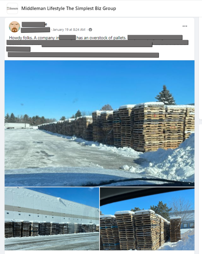 A bunch of wooden pallets are stacked on top of each other in the snow.