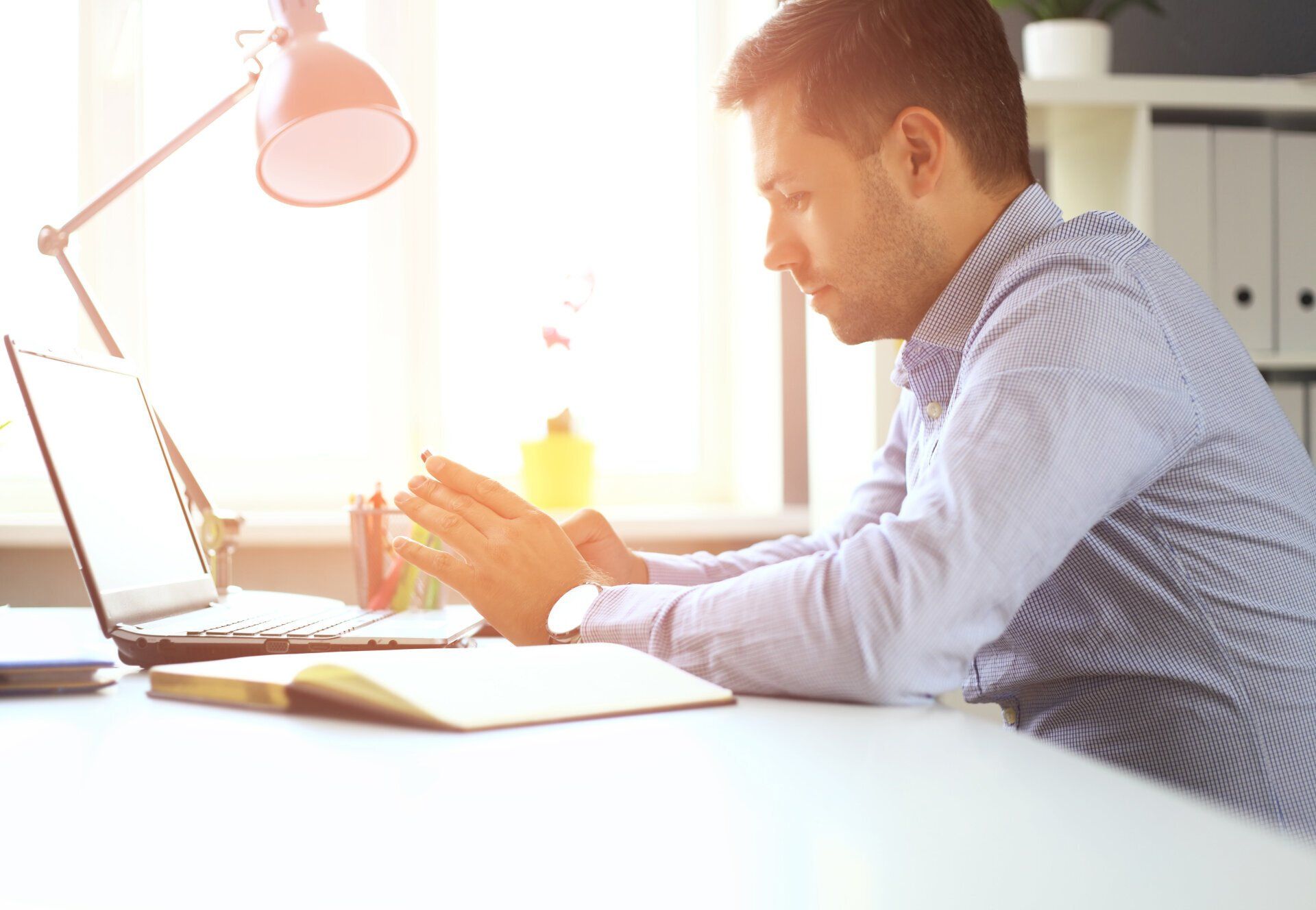 social media, man sitting at desk working hard