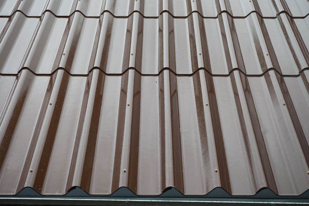 A Close Up of a Brown Corrugated Metal Roof — Roof Restoration Masters In Bonnells Bay, NSW