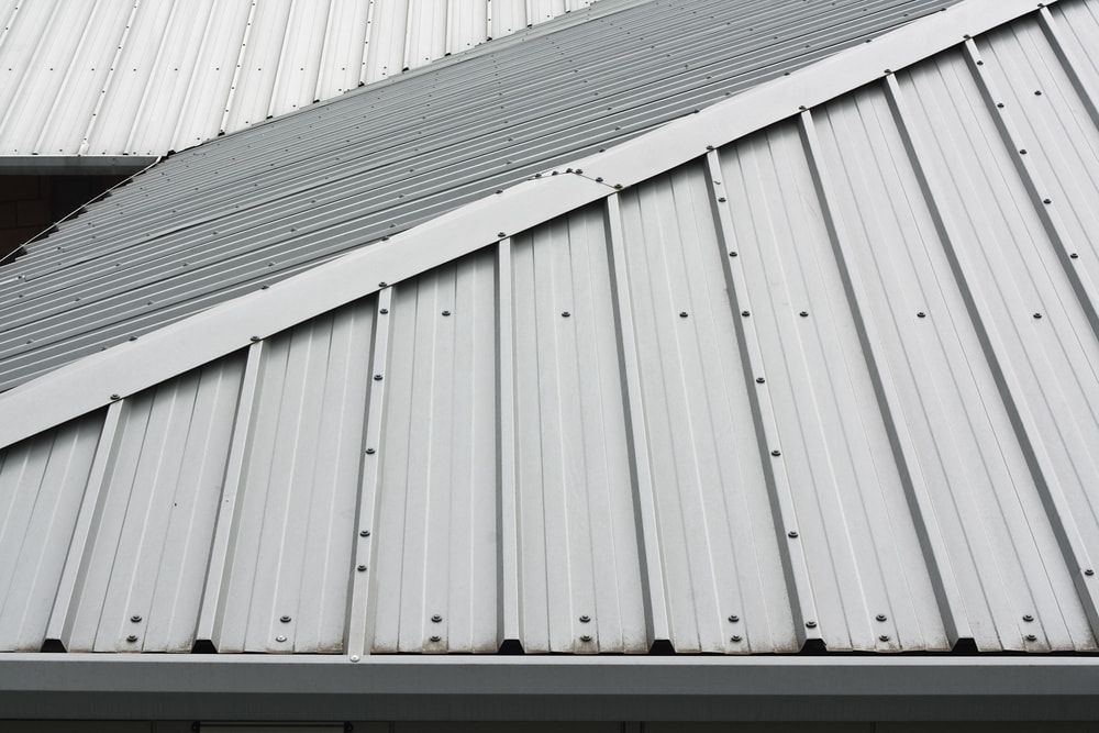 A Close Up of a White Metal Roof — Roof Restoration Masters In Newcastle, NSW