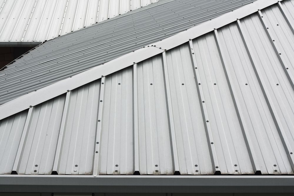 A Close Up of a White Metal Roof on a Building — Roof Restoration Masters In Belmont, NSW