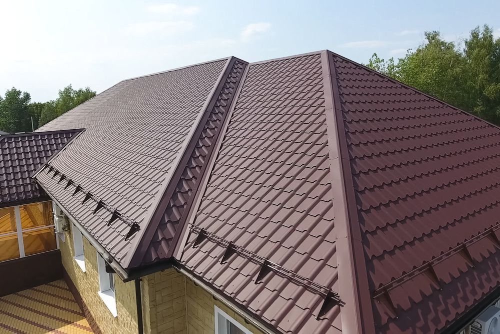 An Aerial View of a House With a Brown Roof — Roof Restoration Masters In Rutherford, NSW