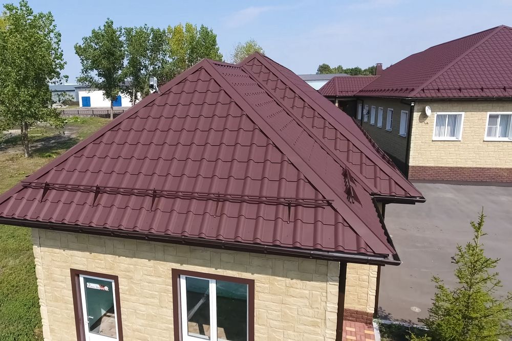 An Aerial View of a House With a Brown Roof — Roof Restoration Masters In Gosford, NSW