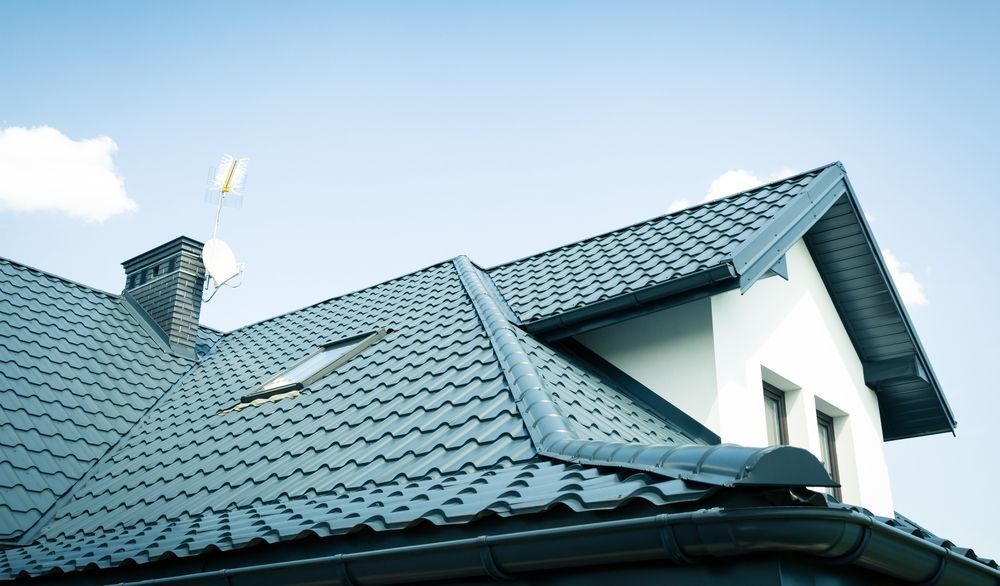The Roof of a House With a Blue Sky in the Background — Roof Restoration Masters In Cooranbong, NSW