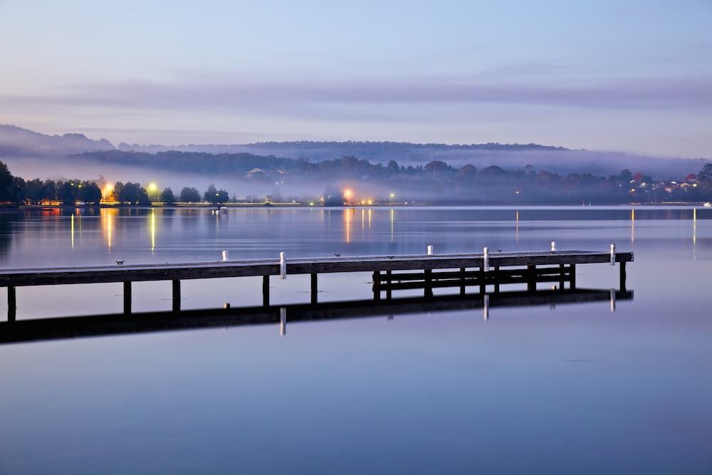 A Dock in the Middle of a Large Body of Water — Roof Restoration Masters In Warners Bay, NSW