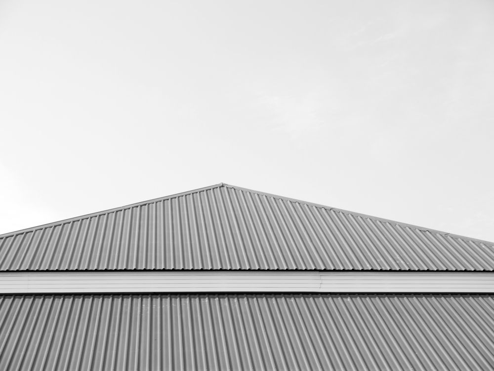 A Black and White Photo of a Roof — Roof Restoration Masters In Gorokan, NSW