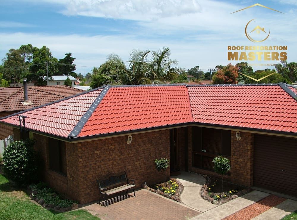 A Brick House With a Red Tiled Roof — Roof Restoration Masters In Wyee, NSW