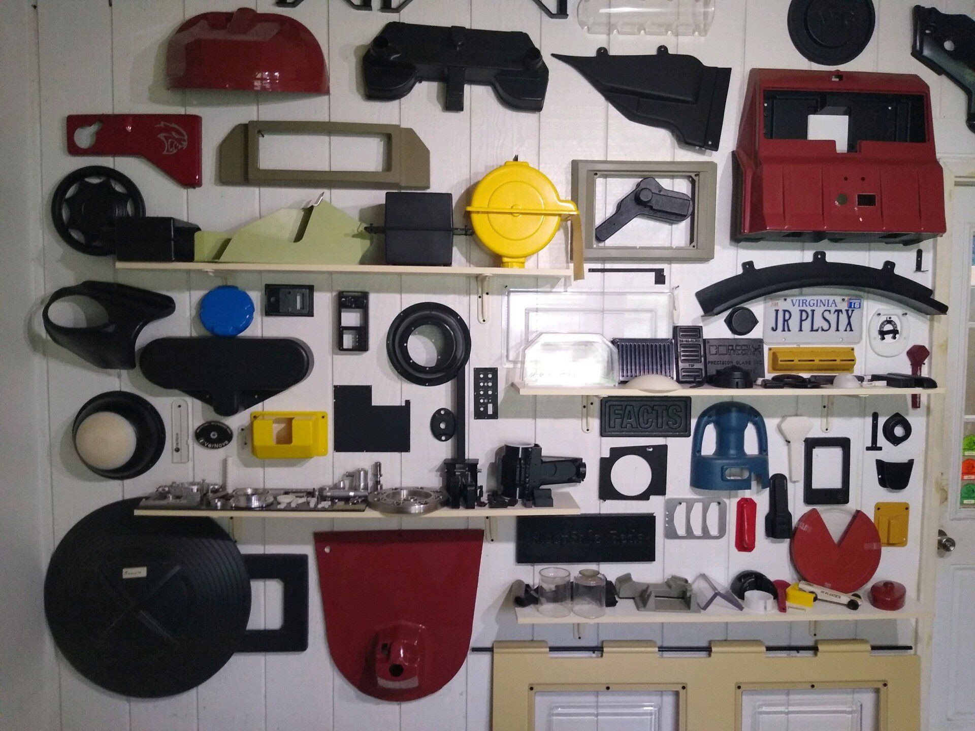 A wall filled with lots of different types of plastic parts