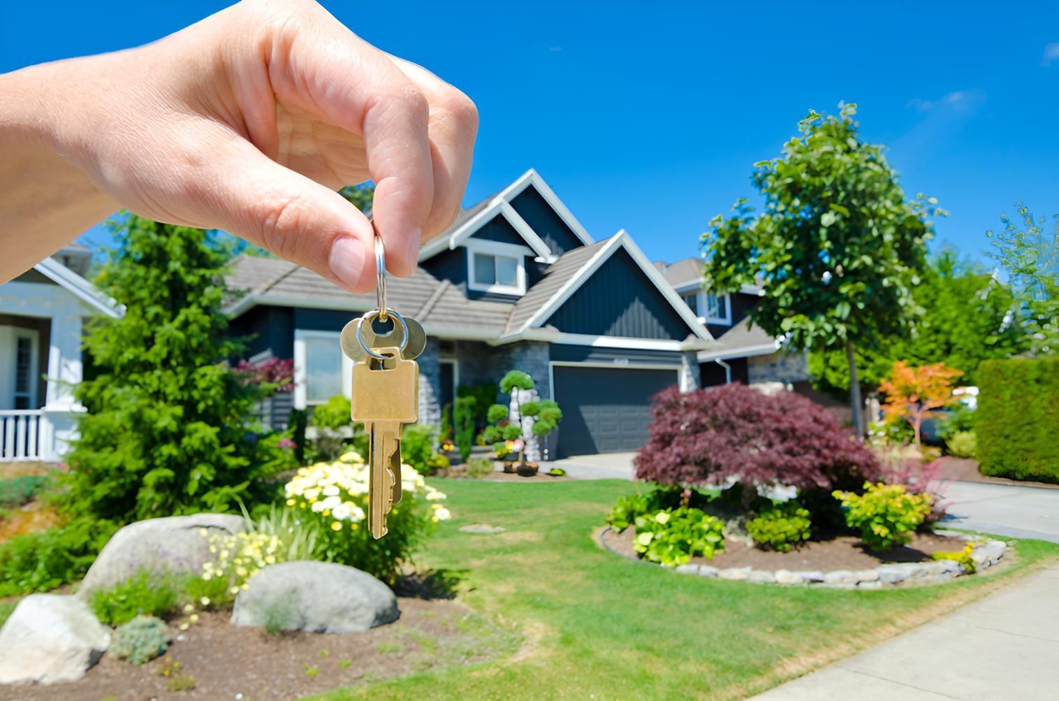 A Person Is Holding A Key In Front — Angel Conveyancing In Larrakeyah, NT