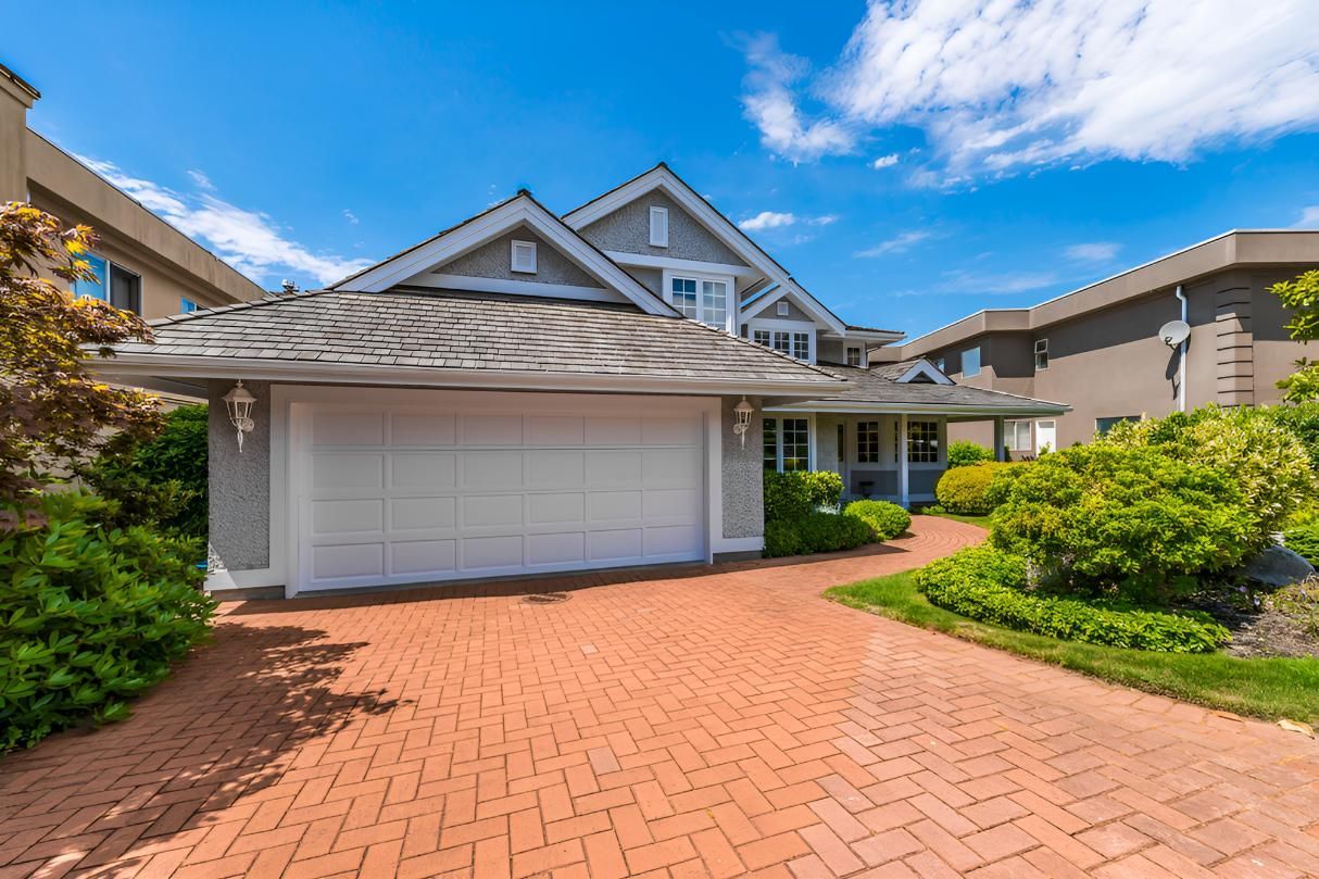 A Large House With A Large Garage And A Brick — Angel Conveyancing In Larrakeyah, NT