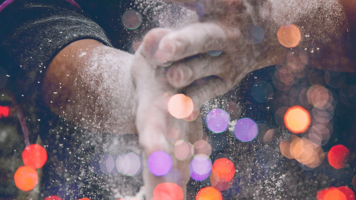 a close up of a person 's hands covered in flour .