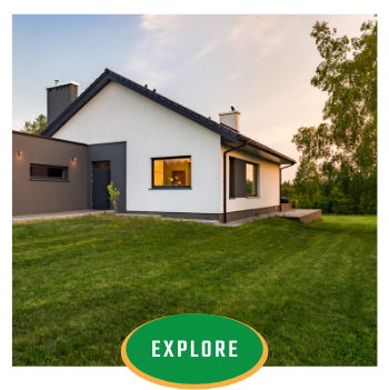 Modern white house with a green lawn at sunset, featuring an “EXPLORE” button overlay