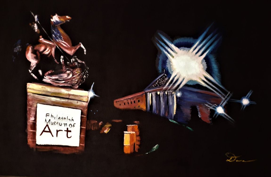 Abstract art still life with a silver figurine, a framed label, a blue starburst object, and small orange pieces on black.