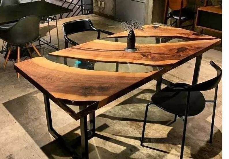 A wooden table and chairs are in a room.
