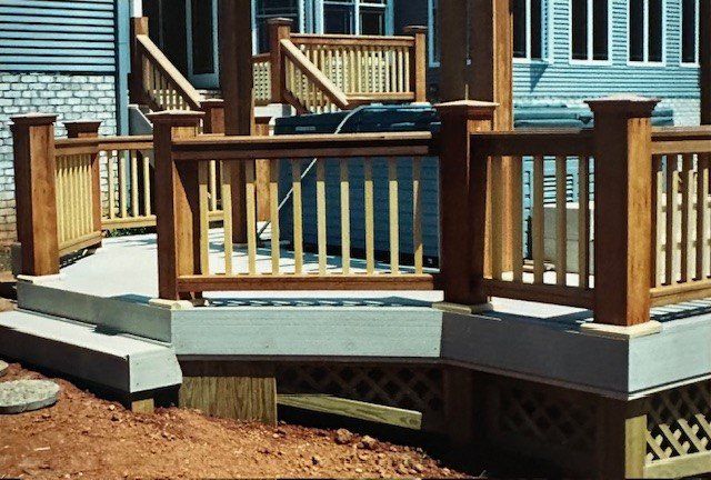 A wooden deck with stairs leading up to it