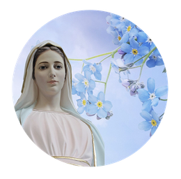 A statue of mary with blue flowers in the background
