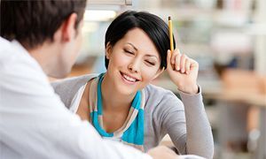 Girl smiling with pencil in hand