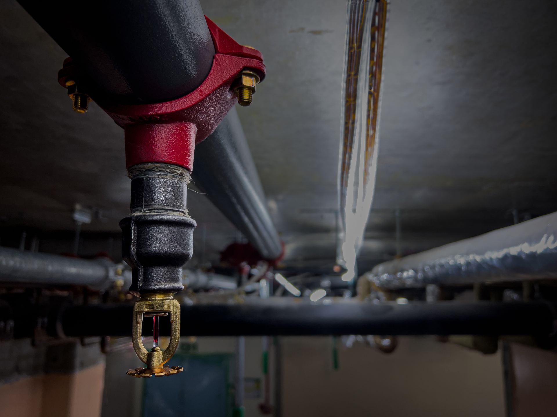 Worker Repairing Fire Alarm — Great Bend, KS — Pryor Automatic Fire Sprinkler Worker Repairing Fire Alarm — Great Bend, KS — Pryor Automatic Fire Sprinkler