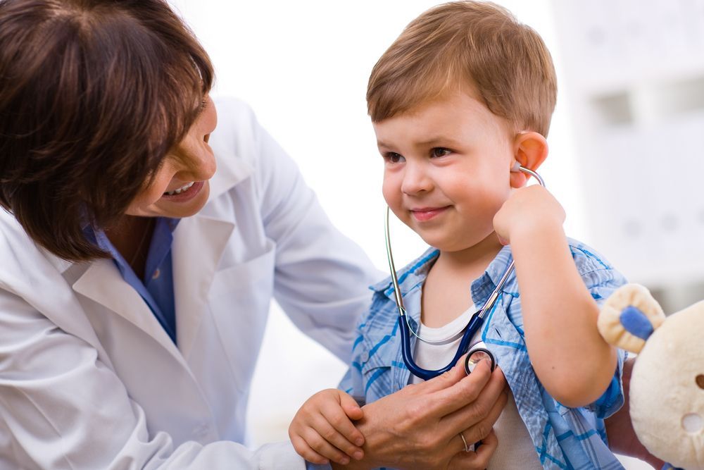 Doctor Examining a Young Child With a Stethoscope — HealthHub Taree in Taree, NSW