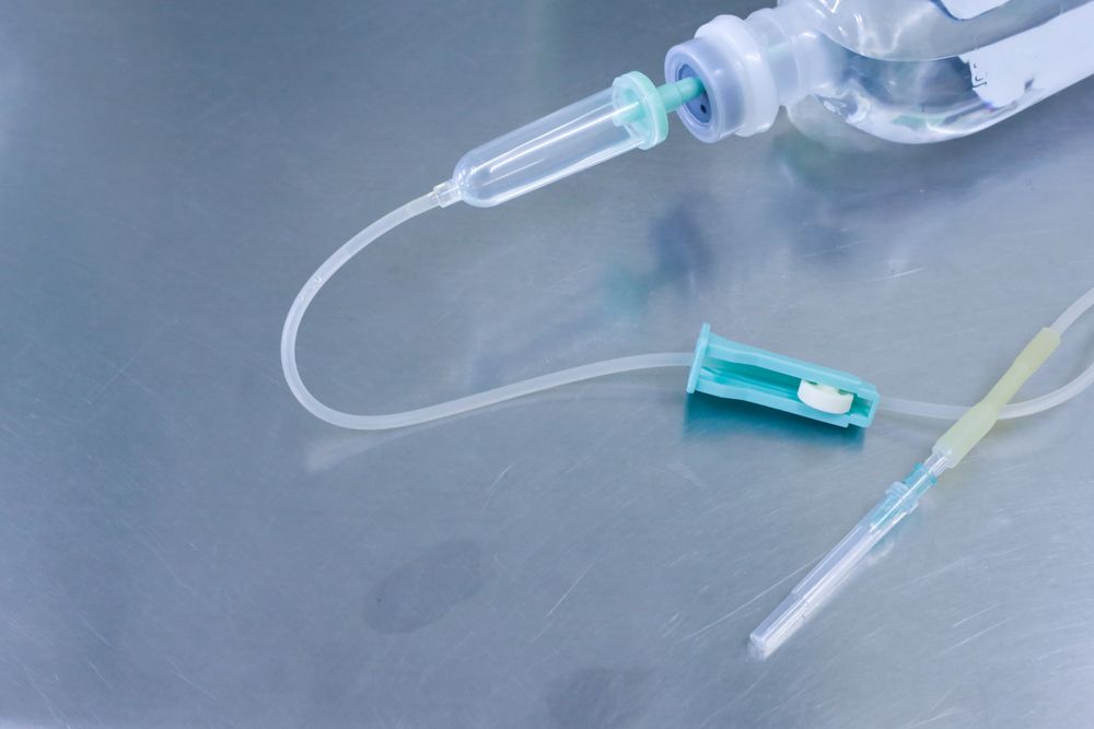 Medical IV Tubing and Syringe on a Stainless Steel Surface — HealthHub Taree in Taree, NSW