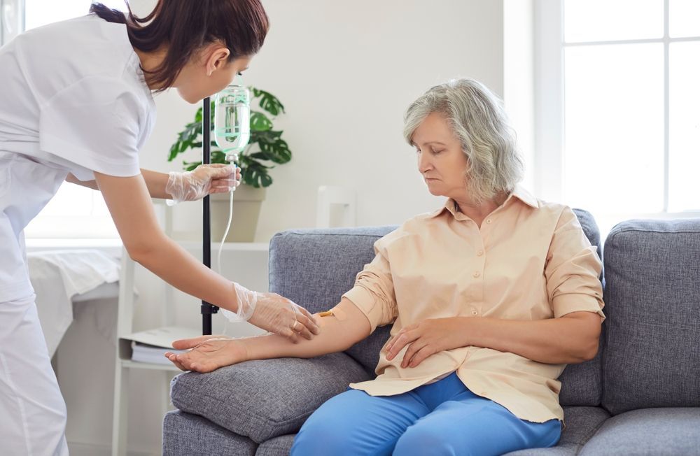 Healthcare Worker Checking a Seated Patient's Blood Pressure — HealthHub Taree in Taree, NSW