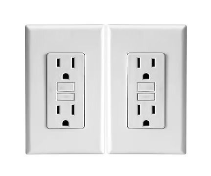 Two white wall outlets with built-in USB charging ports on a white plate