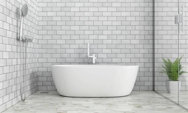 A bathroom with white brick walls and a bathtub.