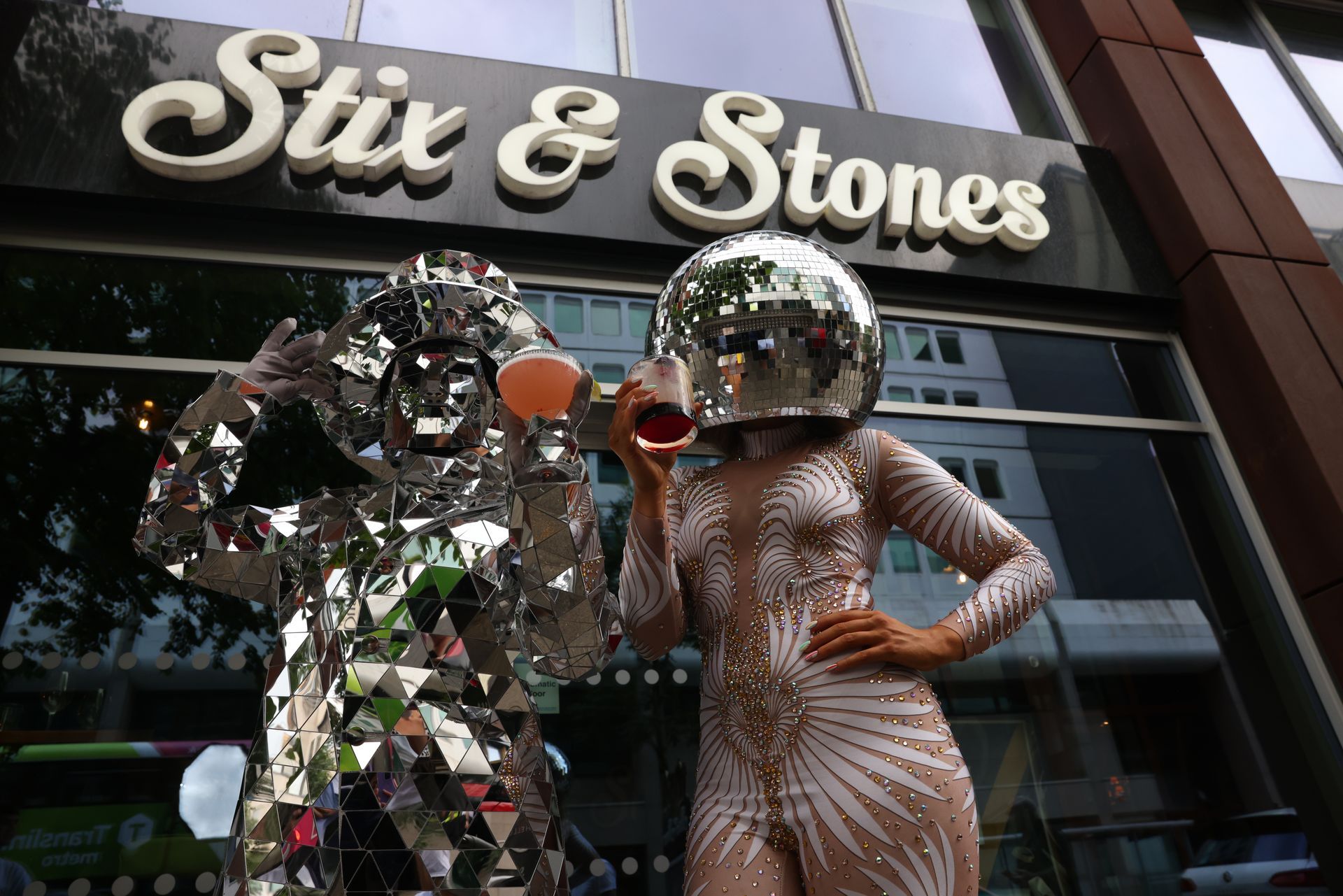 Storefront of Stix & Stones with mirrored sculptures outside the entrance