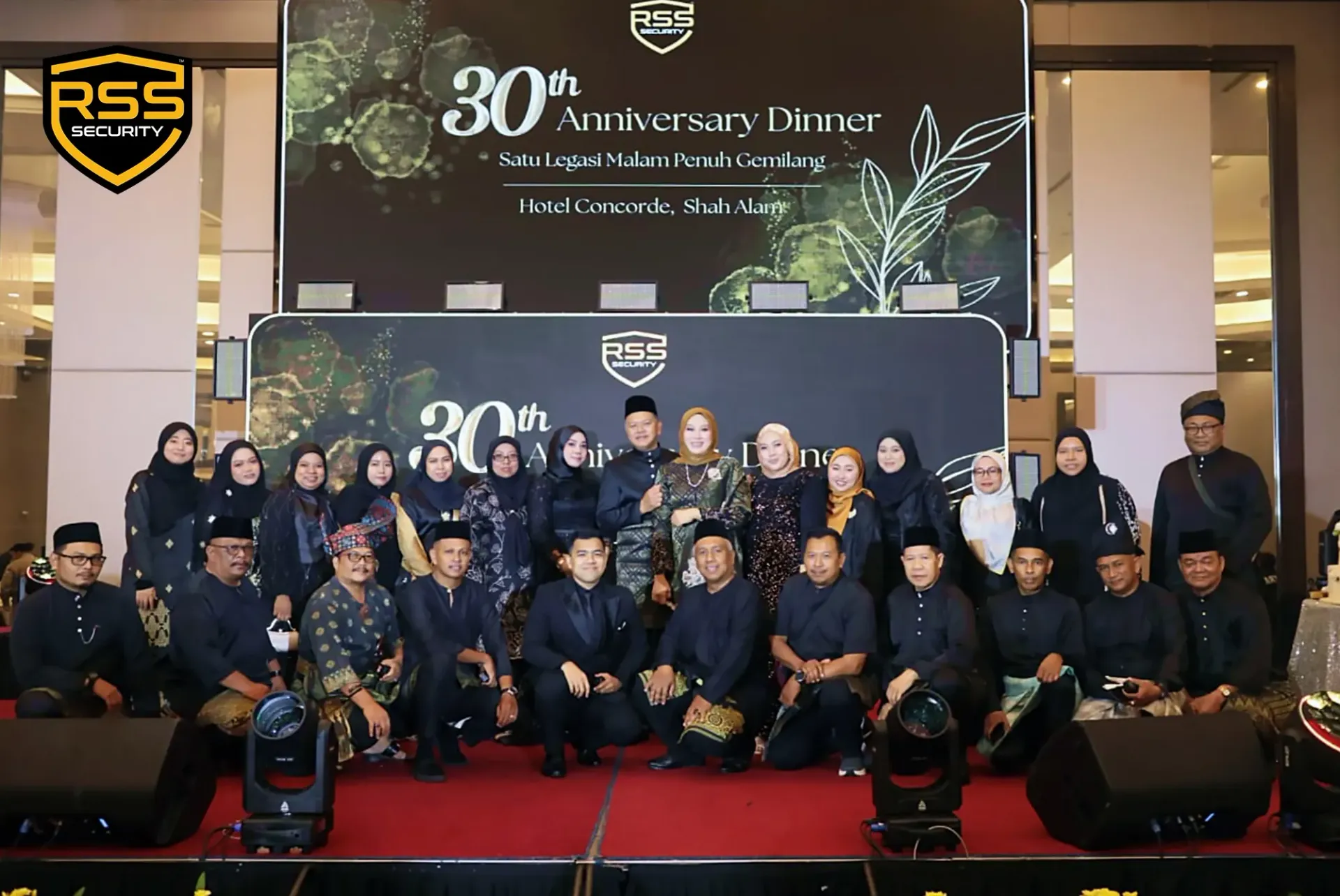 RSS Security's team onstage at a 30th anniversary dinner event