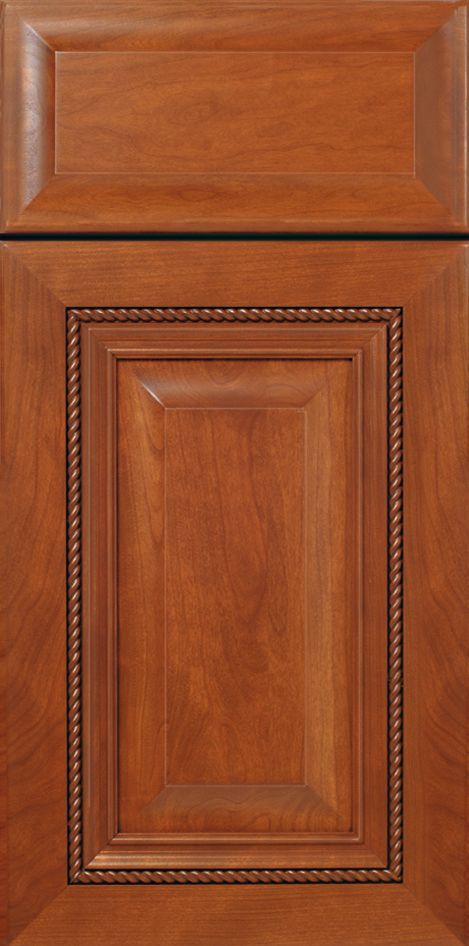 Brown kitchen cabinet door with detailed trim.