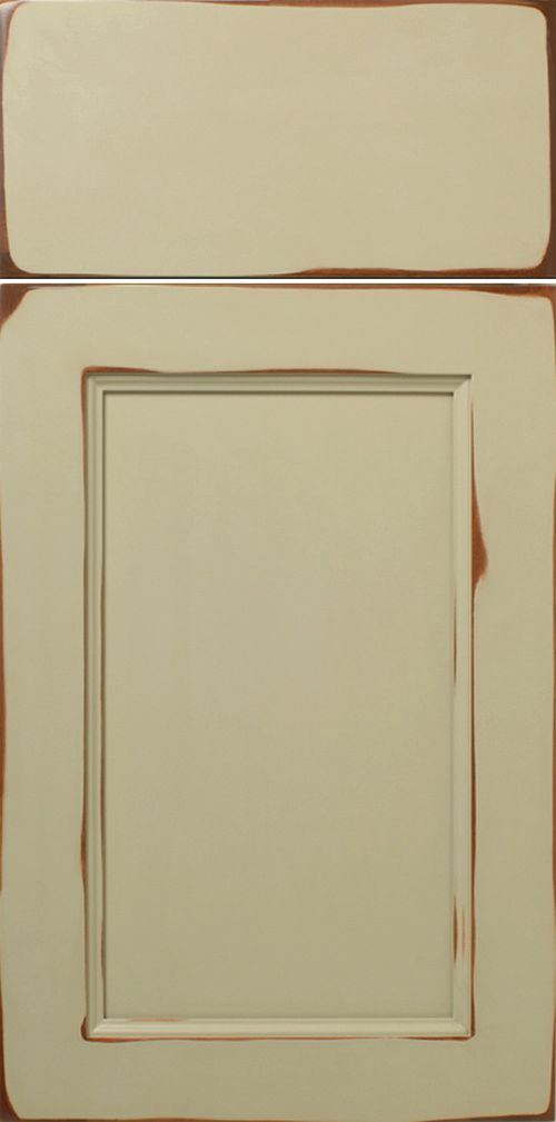 Cream-colored kitchen cabinet doors with distressed brown edges.