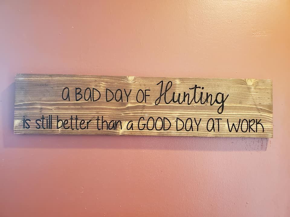 Sign on a pink wall with the text,