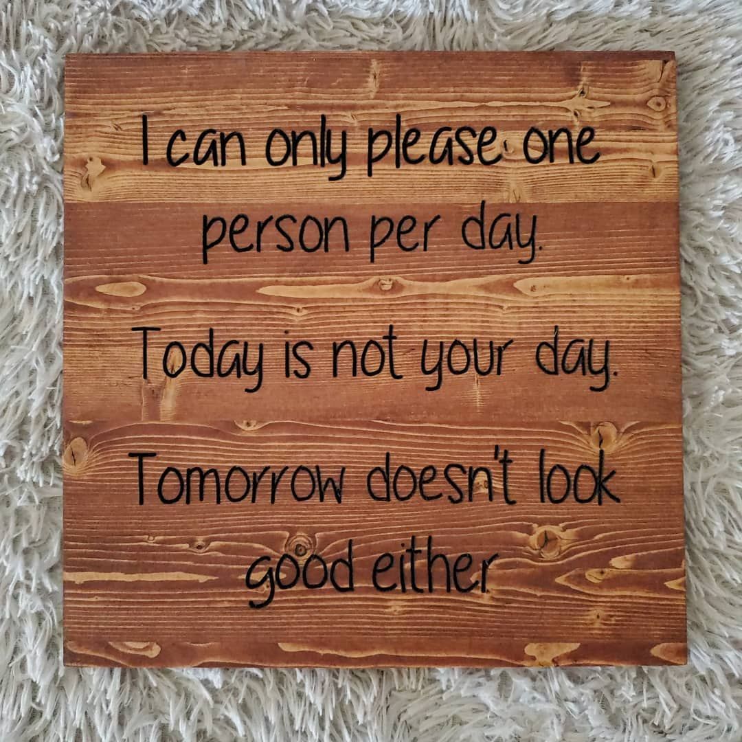 Wooden sign with text: