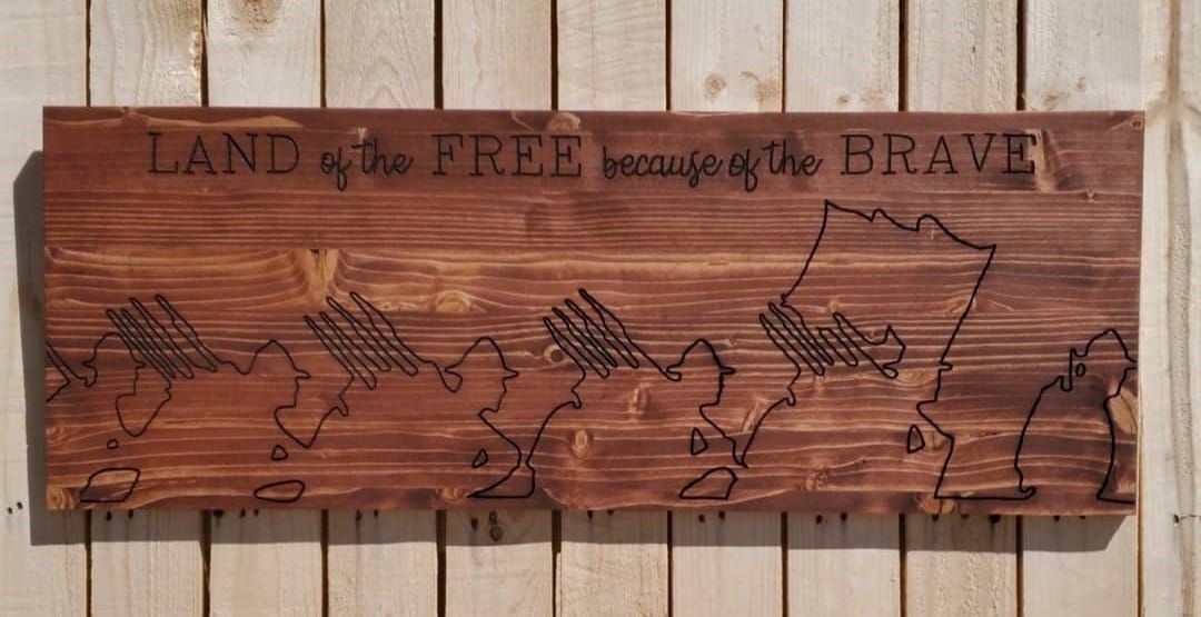 Wooden sign with engraved phrase
