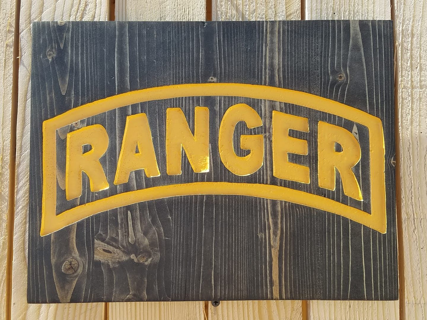 Wooden sign with gold