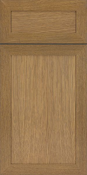Oak cabinet door with inset panel, warm brown tones.