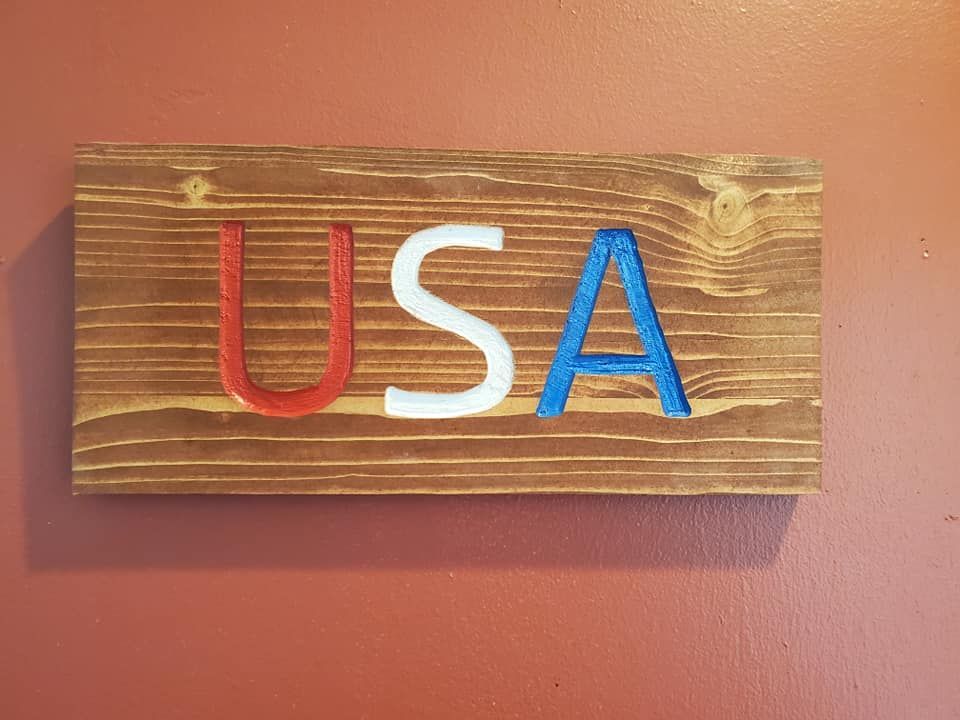Wooden sign with the letters