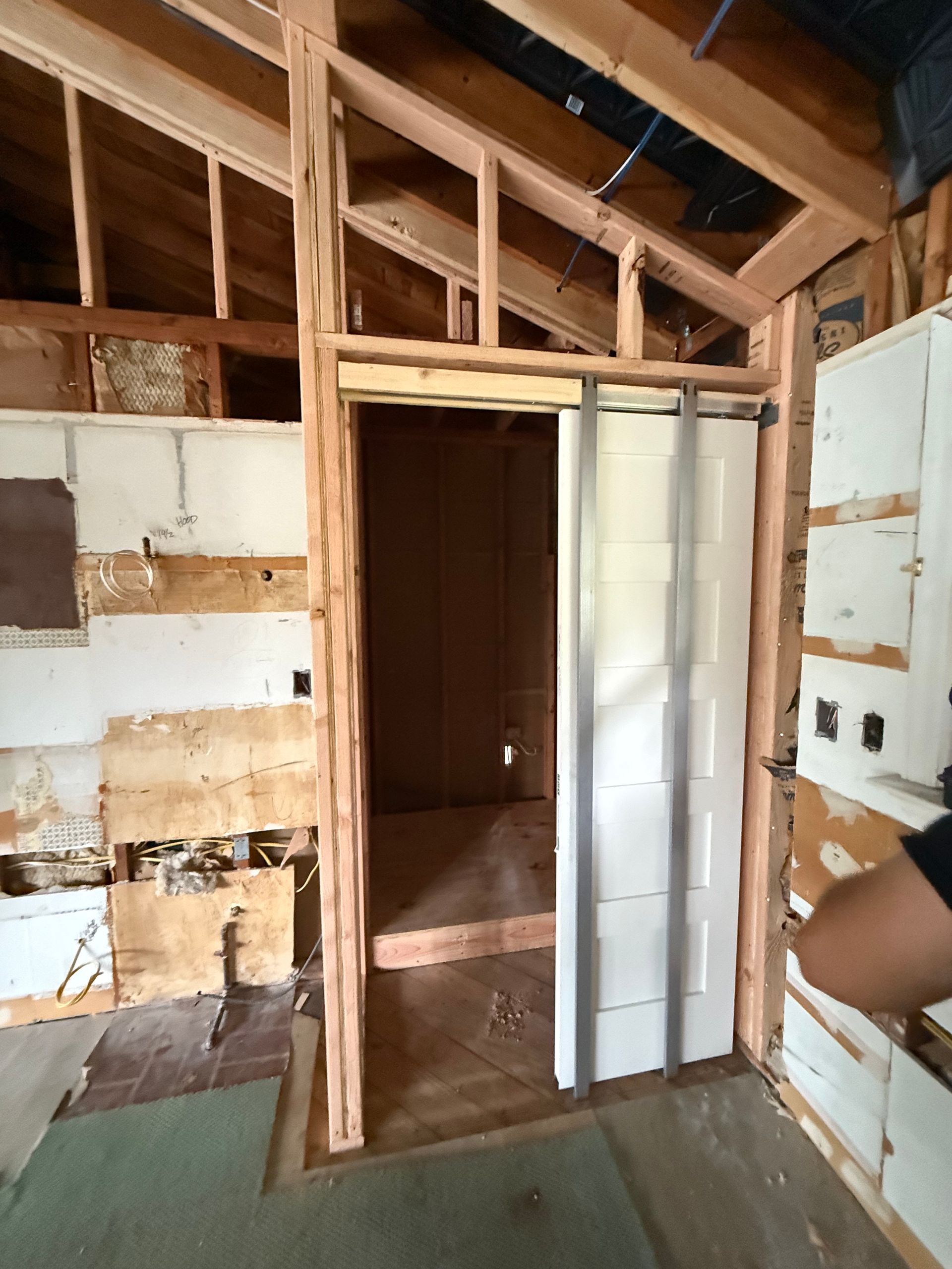 general contracting clermont fl Wooden French doors with glass panes, set in a wood frame and trim, open to an office.