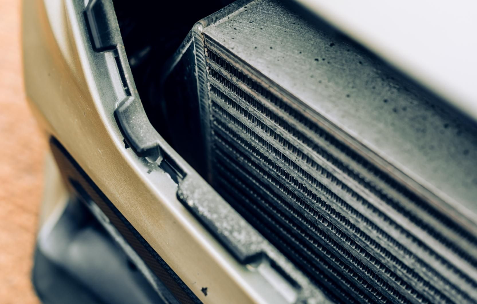 A Close Up Of A Radiator On The Front Of A Car — Hastings Diesel Service In Wauchope, NSW