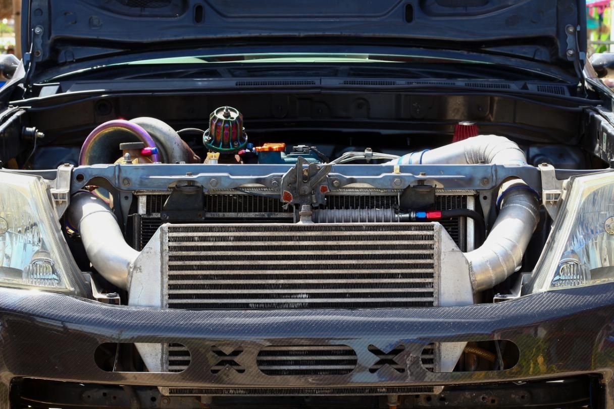 The Front Of A Car With The Hood Open And The Engine Exposed — Hastings Diesel Service In Laurieton, NSW