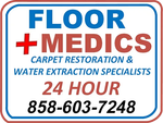 A sign for floor medics carpet restoration and water extraction specialists