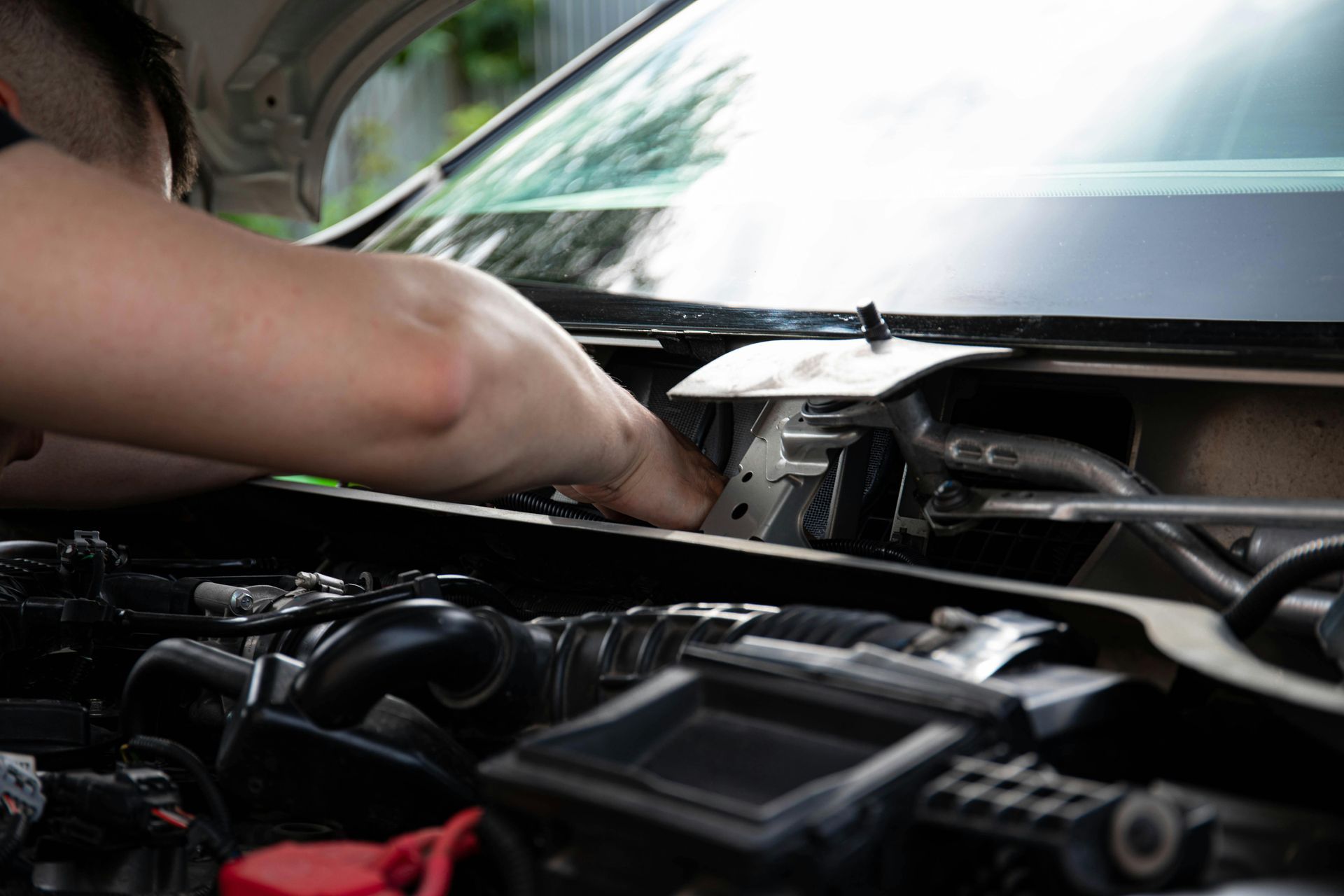 Mechanic Working Under Hood During Vehicle Repair | Dallon's Diesel
