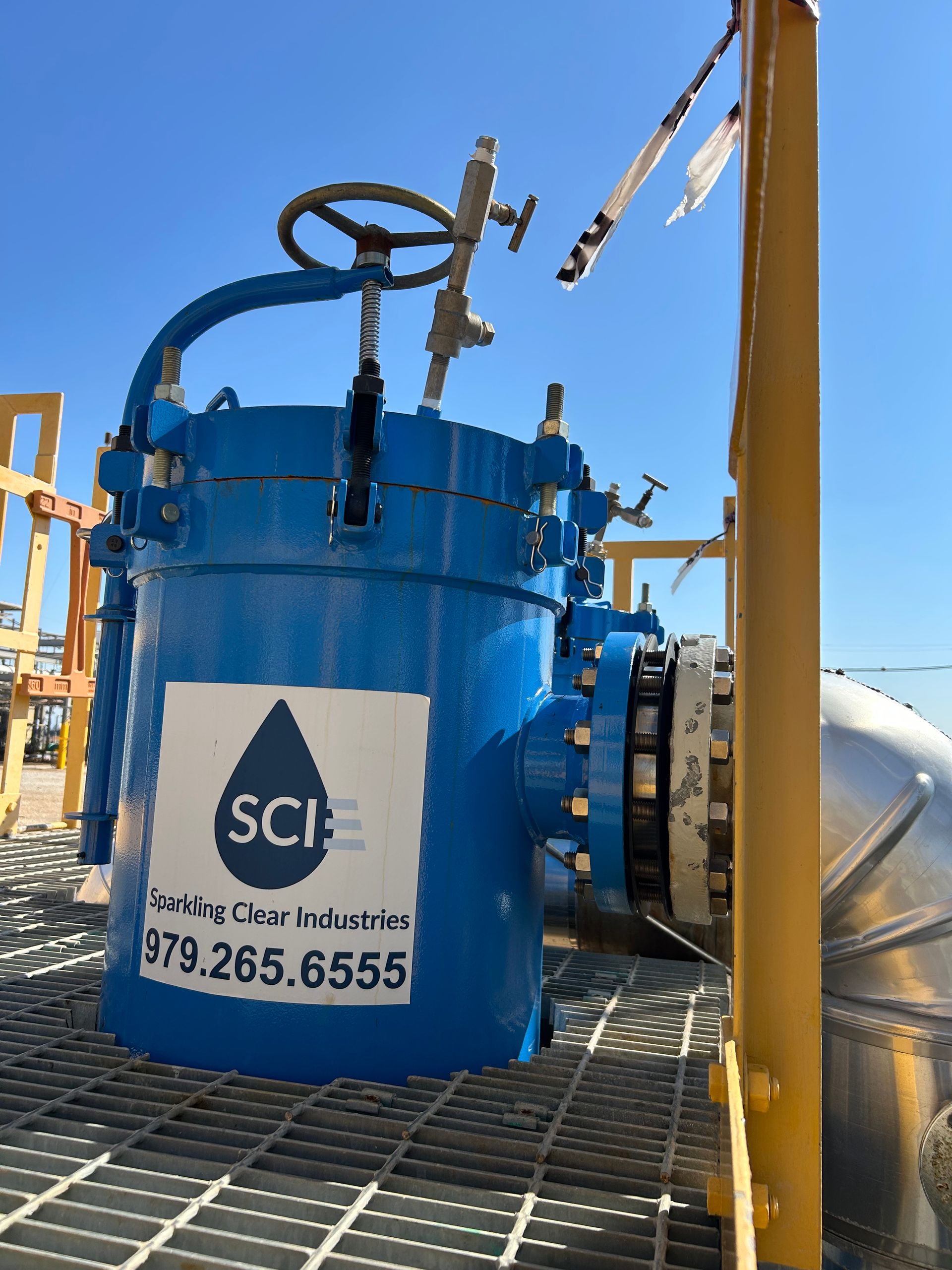 A blue filter housing from Sparkling Clear Industries with the SCI logo on it