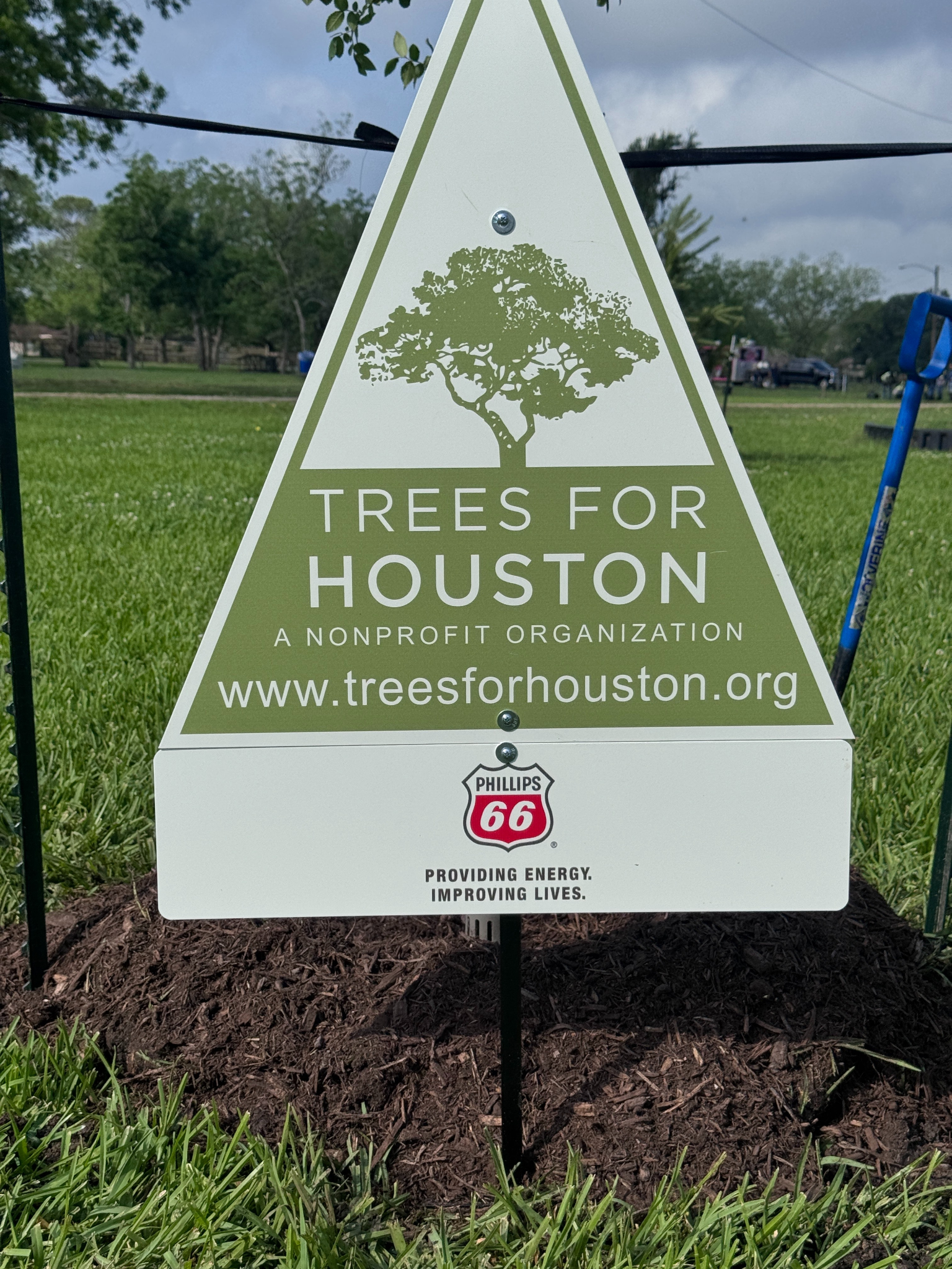 A sign that says trees for houston on it